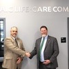 Left to Right: NCMC President Dr. Lenny Klaver and Mosaic CEO Mike Poore shake hands in the MOSAIC Life Care Commons at the NCMC Savannah Campus.