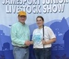 Emma Henderson is shown receiving the Frank Nowland Memorial Award from David Nowland Saturday night at the end of the cattle show at the Jr. Livestock Show. Emma received the award based on Outstanding Livestock display at the fair. The award is based on 1/3 showmanship, 1/3 quality of animals, and 1/3 sportsmanship and conduct. She is a junior at Tri-County High School and the daughter of Chris and Andrea Henderson.